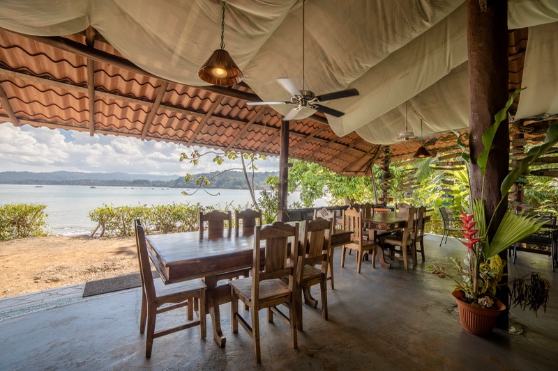 Open-air dining terrace at Hotel Jinetes de Osa looking out over Drake Bay