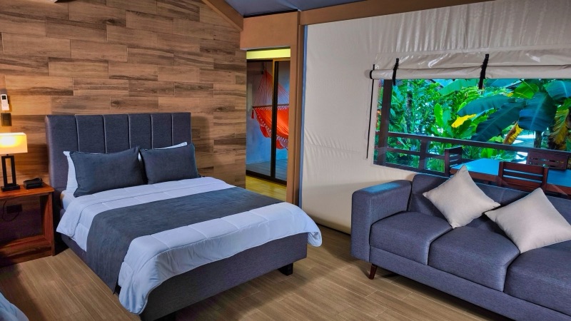 Inside a glamping suite at Valverde Glamping & Ecolodge, with a garden view and hammock deck