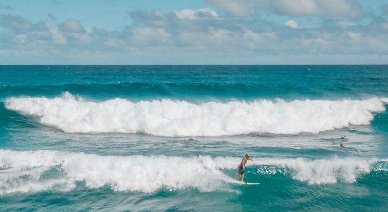 A surfer riding a wave off the south Pacific coast